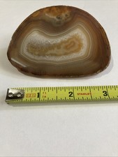 Brown and white natural banded agate slice with beautiful center pattern picture