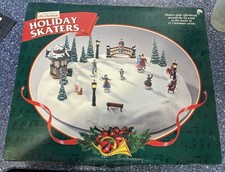 Nwot vintage Christmas skating scene moving skaters, plays 16 carols picture