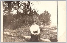 Arlington Wa RPPC Postcard Woman in Hat Sitting on a Log c1900-10s picture