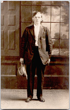 c1909 Young Man in Suit and Hat Standing Studio Portrait RPPC Postcard picture