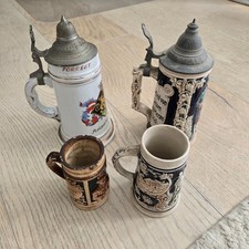 AN AWESOME, (LOT OF 4) GERMAN BEER STEINS. 5”-10”TALL picture