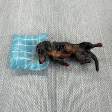 Vintage Dachshund Miniature Figurine Sleeping on Blue Pillow Metal Black Brown picture