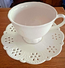 nantucket home porcelain teacup and saucer never used, white and only displayed picture