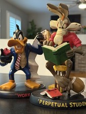 Warner Bros. Daffy Duck and Wile E Coyote Statues picture