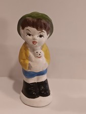 Vintage hand-painted ceramic child figurine holding a doll 3