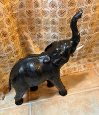 Vintage leather Black elephant figurine trunk up raised trunk with white tusks picture