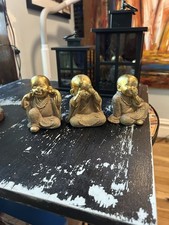 These are golden-finished Baby Buddha Monk Statues picture