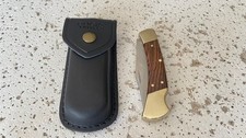 BUCK 110USA Lockback Plain Blade Hunting Pocket Knife Ebony Wood Handle W/Leathe picture