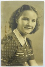 Young Woman in Dotted Patterned Dress and White Collar Portrait - Photograph picture
