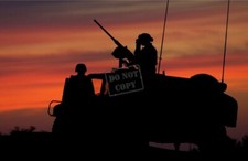 US Army USA Soldiers on a HMMWV equipped with a 50 caliber M2HB machine gun  picture