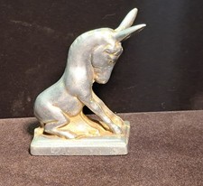 Aluminum sitting donkey on a sturdy metal base picture