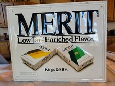 Vintage Embossed Cigarette Advertising Tin Sign - Merit Low Tar Enriched Flavor picture