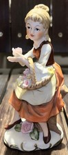 Lefton Vintage Colonial/Country Village Series Bisque Porcelain Girl with Flower picture