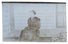 Antique RPPC Postcard Portrait of a Women On A Porch Wearing a Large Fur Stole picture