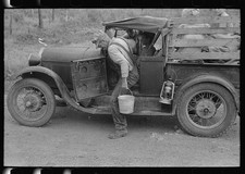 Photo:Henryetta Oklahoma Migrant Getting Water Roadside Camp 1939 picture