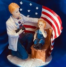 VINTAGE RED WHITE & BLUE PATRIOTIC AMERICAN FLAG FIGURINE DOCTOR W/CHILD picture