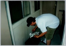 Vtg Color Snapshot Young Man Cap Cooking Foil Packets Porch Grill 1990s picture