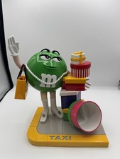 Vintage M&M's Ms. Green Girl M&M Taxi Stand with Gifts Presents Candy Dispenser picture