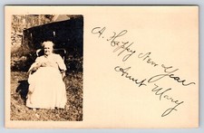 Postcard Unidentified RPPC, Older Women, Sitting Outside Chair Hands Clasped picture