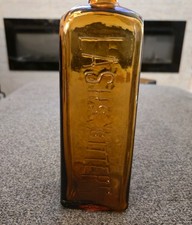 Antique Lash's Bitters Natural Tonic Laxative Amber Embossed Glass Bottle 1900's picture