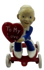Vintage Rosbro Tico Toys Hard  Plastic Valentine Boy With Heart On Wheels picture
