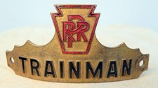 Antique PRR (Pennsylvania Rail Road) TRAINMAN Gilded Hat Badge Early 1900s picture