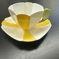 Shelley Yellow Star (Harlequin) 1932 Tulip Handle teacup and saucer set. 12109 picture