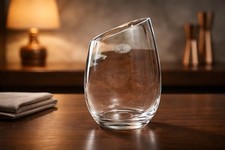 Vintage clear glass vase with an asymmetrical opening and marked “JL”. picture