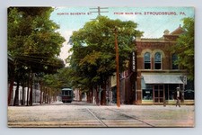 Stroudsburg PA North 7th Street & Main Trolley Car Cigar Store Man Postcard picture