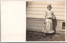 Vintage 1910s Real Photo RPPC Postcard Woman in Native Costume at Side of House picture