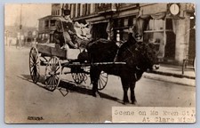 K64/ Clare Michigan RPPC Postcard c1910 Cattle-Drawn Wagon Men Ewen St 261 picture