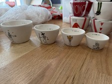 RARE NEW HTF Rae Dunn Ceramic Dancing Skeleton Measuring Cup Set of 4 picture