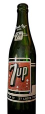 vintage 1950s green glass 7 Up soda bottle with ACL labeling picture