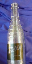 LOT OF 2 VINTAGE NESBITT'S SODA BOTTLES FROM 1938 APPLIED BLACK LABELS BOTH GR8 picture