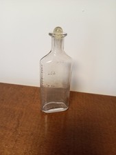 Antique medicine bottle clear glass w/embossed markings no chips w/glass ball picture