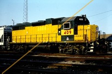 Union Pacific 409 UP KK train slide, GP38-2 CNW colors - Cedar Rapids, IA Aug'03 picture