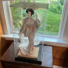 This is a vintage 1960s Japanese Nishi geisha doll in a display case. picture