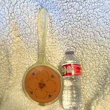 Vintage Plastic Handheld Vanity Mirror with Floral Design Back & Handle picture