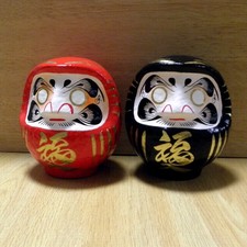 A pair of small Daruma Dolls in red & black colors : No1 size with a marker pen picture