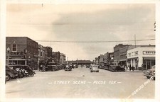 H23/ Pecos Texas RPPC Postcard c30s Street Drug Store Autos Railroad Depot picture
