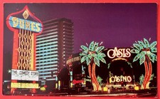 DUNES OASIS HOTEL Night Scene ~ LAS VEGAS~ Comedy Store Marquee ~ postcard~1970s picture