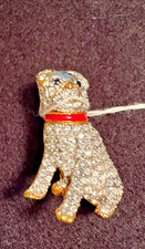 Jeweled PUG with red collar. PIN 1
