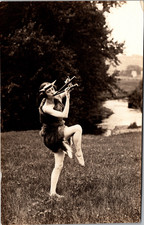 Postcard Real Photo RPPC Woman Dancing in Costume Playing Instrument picture