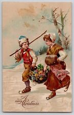 Merry Christmas Dutch Boy Girl Skating Flower Basket Embossed Postcard 1910s picture