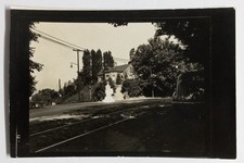 Vintage Real Photo Postcard Street Scene Tram Tracks Monument Stone Building a picture