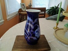 A cobalt blue Fukagawa porcelain vase with a peony motif and gold accents. picture