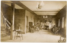 Rustic Lodge Interior Stone Fireplace Wicker Rockers Log Staircase RPPC c1910 picture