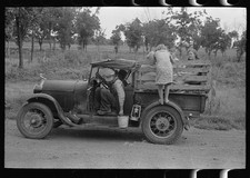 Photo:Henryetta Oklahoma 1939 migrant family roadside camp car pail water picture