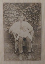 Vintage RPPC Postcard Man Holding Baby Wicker Chair Ivy Background Antique Photo picture
