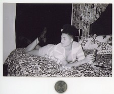 Old 1980's B&W photo / Young Black Woman on Bed with Beer Cigarettes & Remote picture